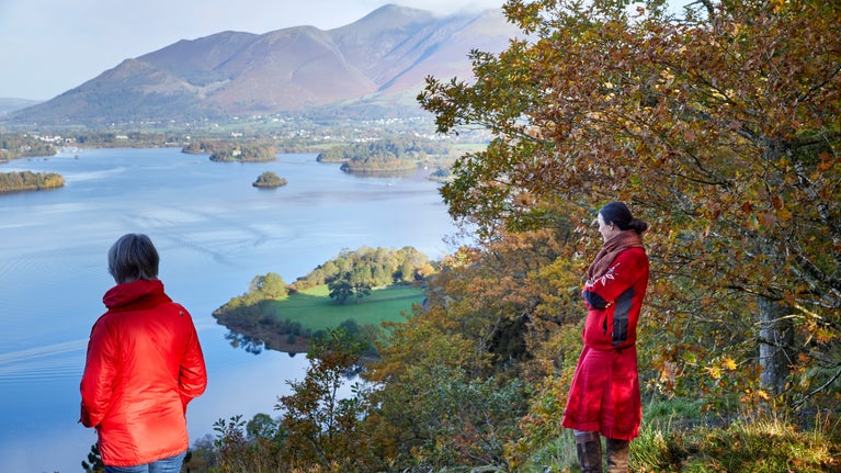 Visitors at Surprise View looking out over Derwent Water and Skiddaw, Borrowdale, Lake District